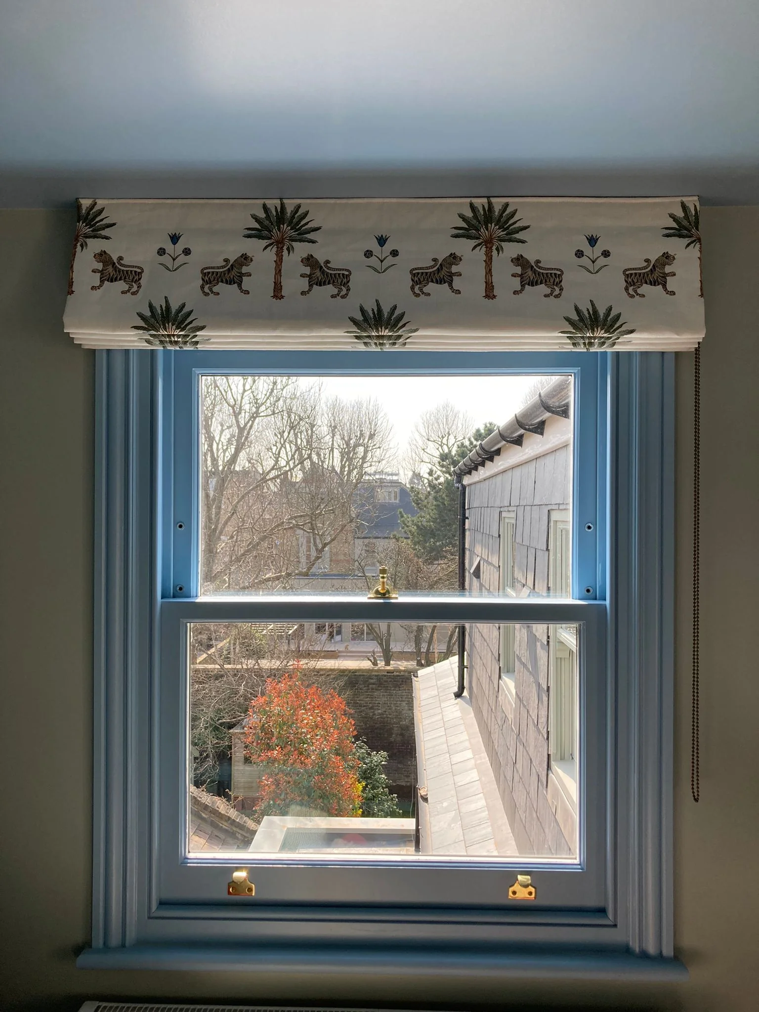 Roman Blind Blue Room Made to measure Roman blind dressing a window in a blue London living room